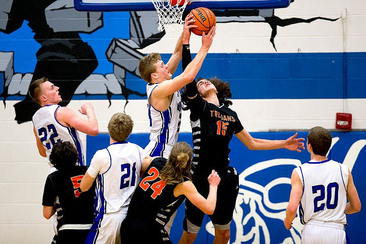 &lt;p&gt;Post Falls' Jacob Pfennigs (15) battles for a rebound with Coeur d'Alene's Joey Naccarato at the 5A Region 1 second-place game on Thursday, Feb. 25, 2016 at Coeur d'Alene High School. Post Falls defeated Coeur d'Alene 77-70.&lt;/p&gt;