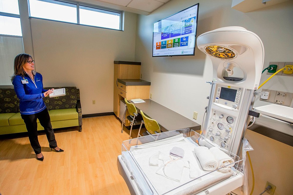 &lt;p&gt;Kim Anderson of Kootenai Health demonstrates how the interactive paitent care board, top, modernizes and improves a family's hospital experience while they are staying in a postpartum room. The care boards are available in every room in the new expansion, and allow patients to independently do things such as order food, request help and watch movies&lt;/p&gt;