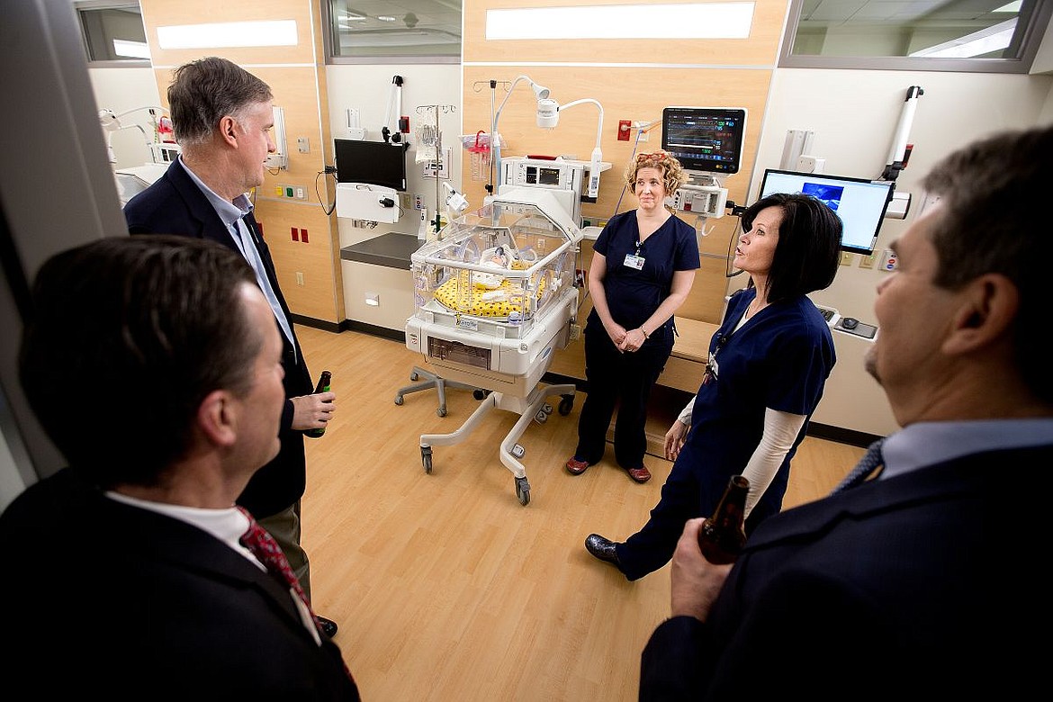 &lt;p&gt;Registered Nurses Tracy DeWitt, second from right, and Heather Krajic talk to visitors about the features of the neonatal intensive care unit on Thursday at the grand opening of Kootenai Health's new expansion. The neonatal intensive care unit houses private twelve rooms to accommodate up to fourteen babies, where mothers can stay with their babies at all times.&lt;/p&gt;