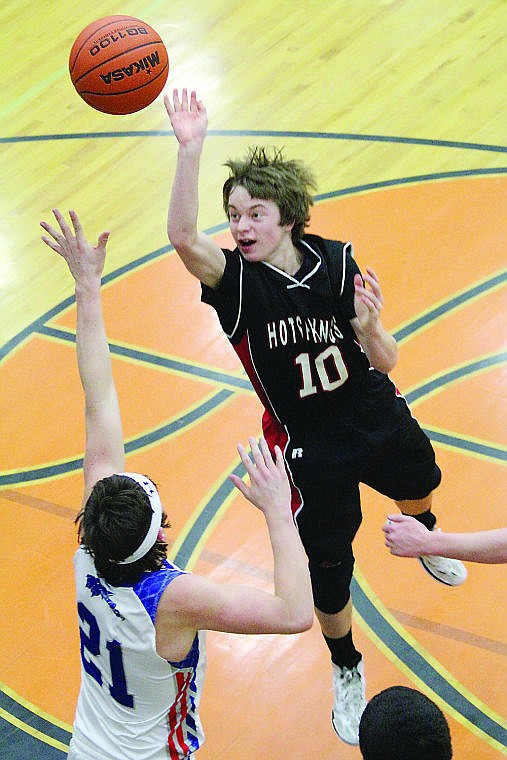 &lt;p&gt;Trevor Paro of Hot Springs floats a shot over Superior's Tanner Smith in Friday's semifinal action.&lt;/p&gt;