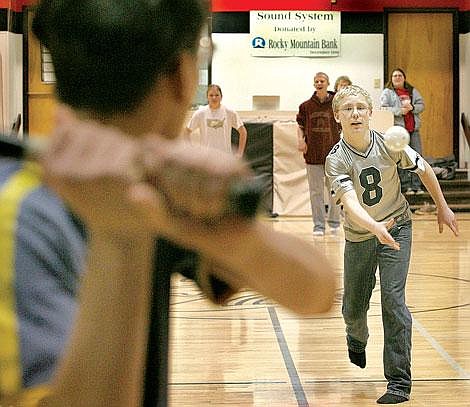 Photo by Ed Moreth Eric Rummel of team three pitches one to Cody Allestad of team two at Plains High School gymnasium as part of &#147;Through With Chew Week.&#148; Team 3 won.