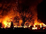 The former Stimson Lumber Co. plywood plant in Libby burns on Thursday night. "It looked like someone dropped an atomic bomb," Sheriff Daryl Anderson said of the massive fire and smoke plume.