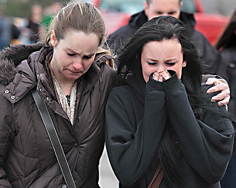 &lt;p&gt;A distraught Ava Polaski, a sophomore, leaves school grounds with her mother Misty Polaski following a shooting in Chardon, Ohio on Monday, Feb. 27, 2012. A teenager described as a bullied outcast at Chardon High School opened fire in the cafeteria Monday morning, killing one student and wounding four others before being caught a short distance away, authorities said. The suspect, whose name was not released, was arrested near his car a half-mile away, the FBI said. He was not immediately charged. (AP Photo/The Plain Dealer, Thomas Ondrey) MANDATORY CREDIT&lt;/p&gt;