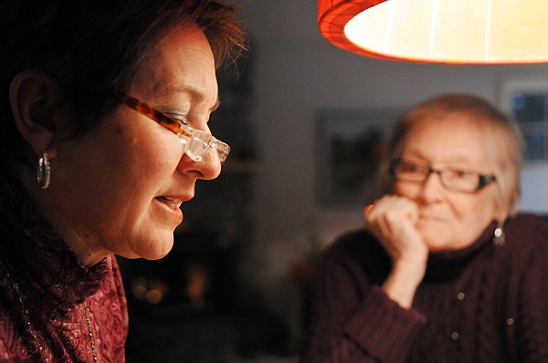 Leslie Collins of Whitefish helps Joan Binnie read through and organize the papers they will send with the guitar to the Canadian War Museum in Ottawa.