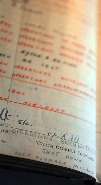 Detail shot of Binnie's pilot's log book for the Royal Air Force. It shows March 11, 1941 as the date he was shot down over Alkmaar, Holland. Of the seven member crew Alf and one other survived the crash. According to Leslie Collins the Germans held pilots in high regard and therefore worked to save his leg which was badly damaged by bullets and shrapnel from the attack.