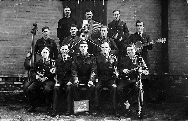 A group of POWs who received instruments at Stalag IX C near Buchenwald, Germany. Alfred &quot;Alf&quot; Binnie is far right, middle row. The guards always made the POWs dress for promo pictures.