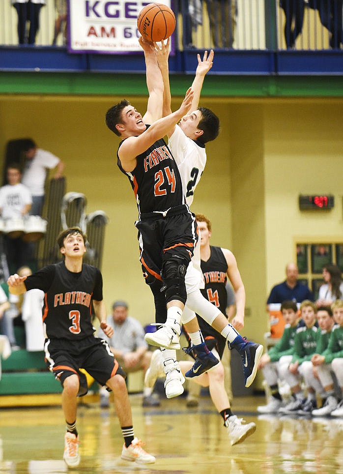 <p>Flathead's C.J. Dugan tips the ball away from Glacier's Dylan Ruggles as he steals the ball away. (Aaric Bryan/Daily Inter Lake)</p>