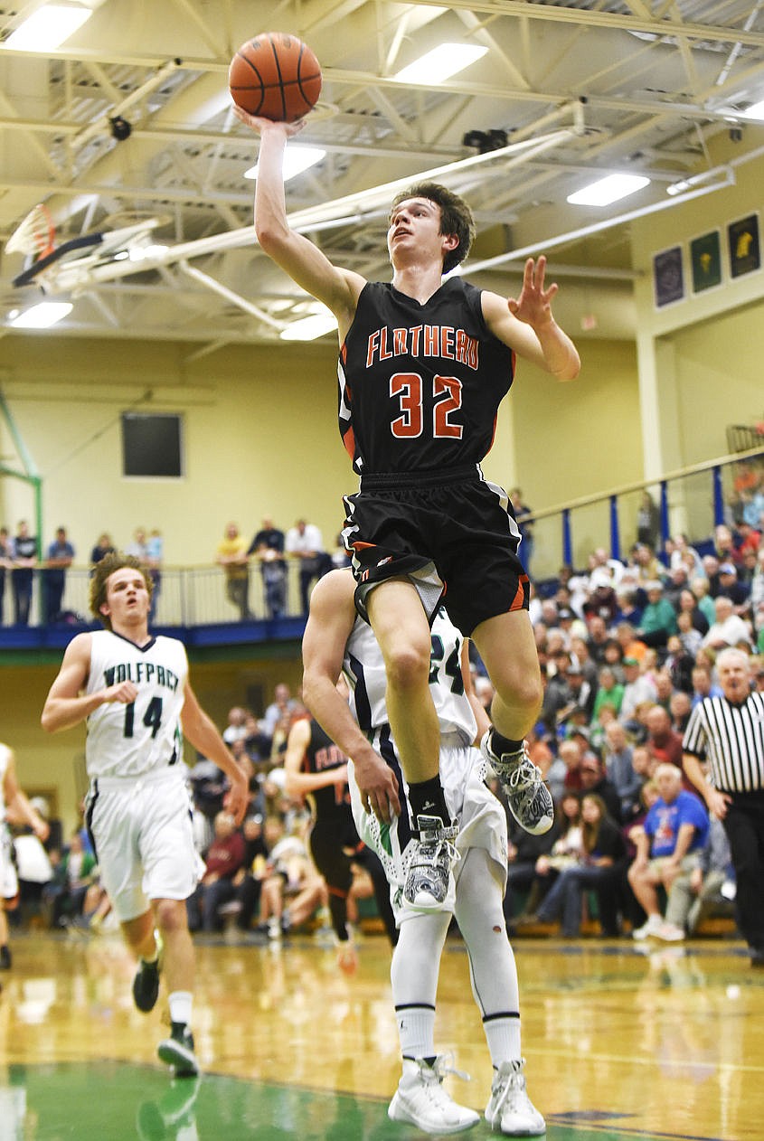 <p>Flathead's Tyler Johnson soars in for a layup against Glacier during the second quarter. (Aaric Bryan/Daily Inter Lake)</p>