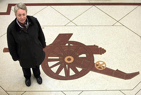 &lt;p&gt;Kate Mackle poses next to the Arsenal emblem in the entrance to the housing development where Highbury, the former Arsenal football ground once stood, in north London.. Four years ago, Highbury, the site of the Premier League's club's old stadium, was added to the long list of historic football venues abandoned in the wake of English clubs' desire to improve facilities and boost revenue with bigger crowds. But what is now called 'Highbury Square' still looks just like an old-fashioned football stadium: apartments are built into the Art Deco facades of the 1930s main stands and face onto a 2-acre garden growing where the field used to be. (AP Photo/Lefteris Pitarakis)&lt;/p&gt;