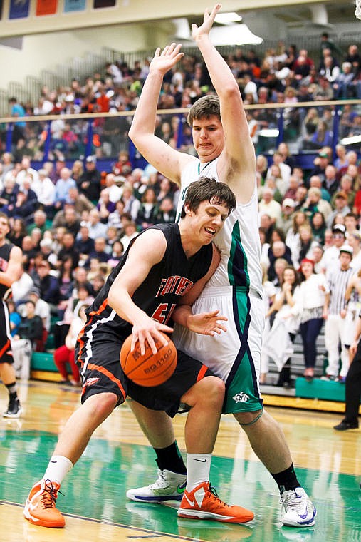 &lt;p&gt;Glacier senior post Ryan Edwards (44) defends Flathead senior Garth West (54) Thursday night during the crosstown basketball game at Glacier High School. Thursday, Feb. 21, 2013 in Kalispell, Montana. (Patrick Cote/Daily Inter Lake)&lt;/p&gt;