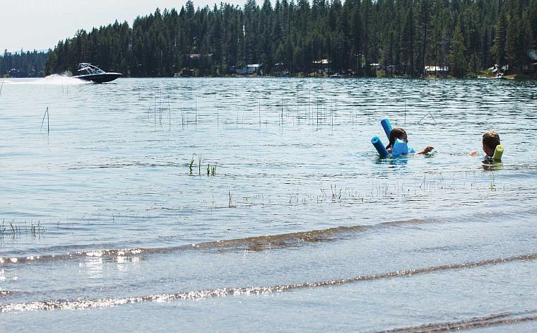 &lt;p&gt;Proposals to limit boat wakes on Echo Lake have stirred up strident opposition from some Echo Lake residents. In this July 2012 photo, Ashley and Zoe Chapman swim near the Echo Lake Causeway. (Patrick Cote file photo/Daily Inter Lake)&lt;/p&gt;