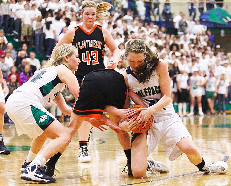 &lt;p&gt;Glacier sophomore forward Katie Wiley (right), Flathead senior Sani Davis (center) and Glacier senior guard Kailea Vaudt (14) fight for a loose ball Thursday night during the crosstown basketball game at Glacier High School. Thursday, Feb. 21, 2013 in Kalispell, Montana. (Patrick Cote/Daily Inter Lake)&lt;/p&gt;