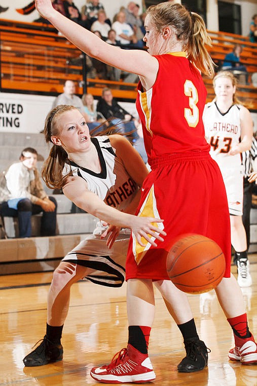 &lt;p&gt;Flathead senior Dani Davis (11) passes the ball Tuesday night during the Bravettes' win over Hellgate. (Patrick Cote/Daily Inter Lake)&lt;/p&gt;