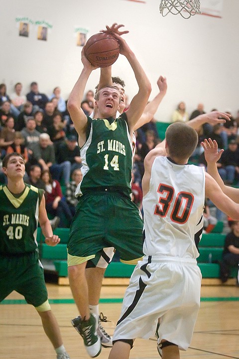 &lt;p&gt;Zach Lehman (14) of St. Maries takes the ball to the basket Friday night vs. Priest River.&lt;/p&gt;