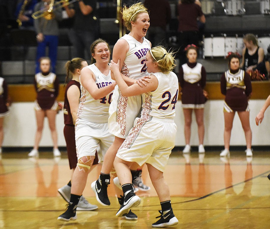 &lt;p&gt;Bigfork's Jamie Berg (20) jumps in the air as she celebrates with teammates Katie Thomas (24) and Miranda Campbell (40) after beating the Florence Falcons 52-41 to finish third at the Western B Divisionals and advance to the state tournament. (Aaric Bryan/Daily Inter Lake)&lt;/p&gt;