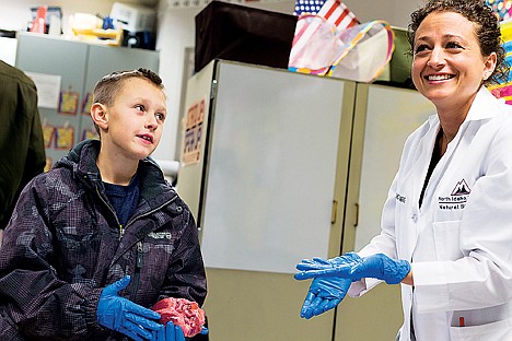 &lt;p&gt;Kayla Sedlacek, lab instructor for North Idaho College&#146;s anatomy and physiology department, reacts as third grade student Kaulin Knoll compares a pig heart to a video game Thursday during a Fernan Family STEM Night at the Coeur d&#146;Alene elementary school.&lt;/p&gt;