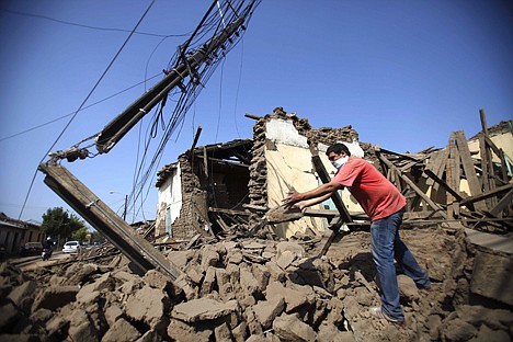 &lt;p&gt;A resident removes the rubble of a destroyed house in Talca, Chile, Saturday, Feb. 27, 2010, after an 8.8-magnitude struck central Chile. The epicenter was 70 miles (115 kilometers) from Concepcion, Chile's second-largest city. (AP Photo/Roberto Candia)&lt;/p&gt;