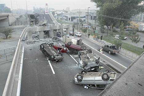 &lt;p&gt;Vehicles that were driving along a highway that collapsed during the earthquake near Santiago are seen overturned on the asphalt Saturday Feb. 27, 2010 after an 8.8-magnitude earthquake struck central Chile early Saturday. The quake hit 200 miles (325 kilometers) southwest of the capital and the epicenter was just 70 miles (115 kilometers) from Concepcion, Chile's second-largest city,( AP Photo/David Lillo)&lt;/p&gt;