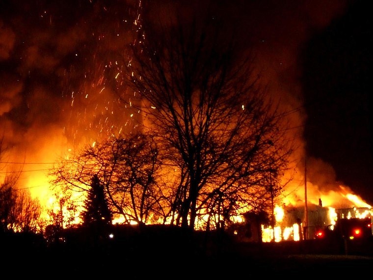 Flames roar from the former Stimson plywood mill in Libby on Thursday night.