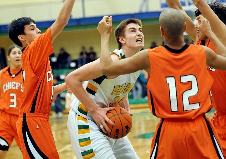 Whitefish senior Connor Silliker (34) tries for two under pressure from a host of Ronan defenders during their game on Thursday during the Northwestern Class A Divisional Program. Ronan won the game 56 to 41.