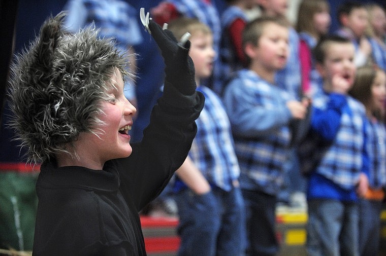 Canyon Elementary School second-grader Jacob Ottwell, dressed as the Big Bad Wolf, waves to the crowd during the school's production of &quot;The Three Piggy Opera&quot; on Friday in Hungry Horse. Ottwell's twin sister Hannah played one of the little pigs.