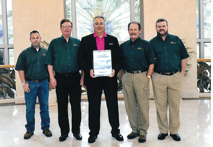 Lad of Moses Lake from left to right. James Wilson, Doug Muscott, Len Adams (President, Valmont Irrigation), Nick Meyer, and Cory Sharp.