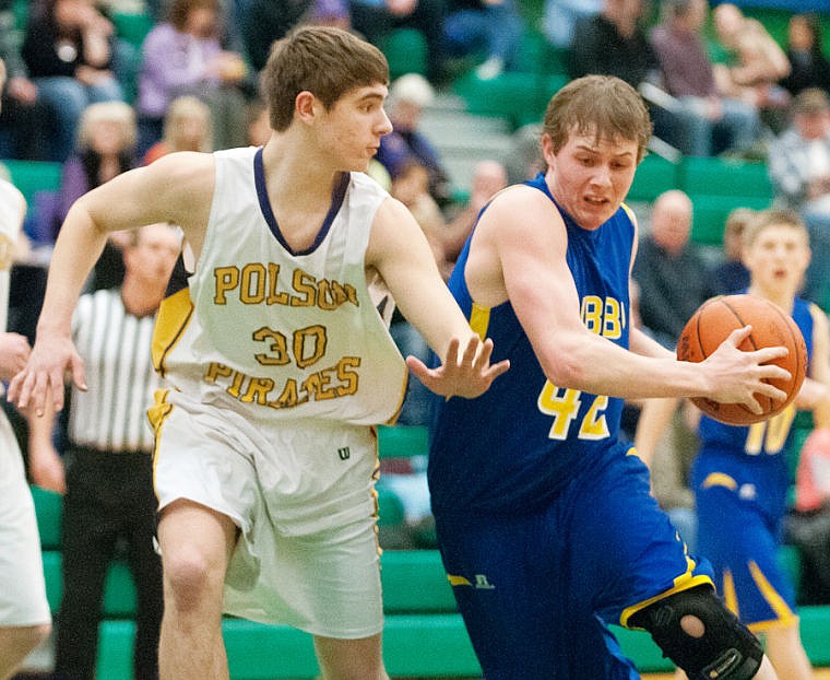 &lt;p&gt;Libby senior wing Quinn Sullivan (42) drives around Polson freshman guard Tanner Wilson (30) Thursday night during the Northwestern A Divisional tournament at Glacier High School. Feb. 27, 2014 in Kalispell, Montana. (Patrick Cote/Daily Inter Lake)&lt;/p&gt;