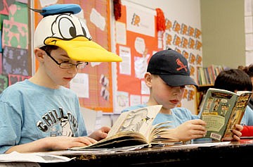 &lt;p&gt;Nicholas Dresen, left, and Bernie Gordish read in Peggy Rowe's third grade class at K. William Harvey Elementary School in Ronan last Friday. Students wore hats to celebrate I Love to Read Month, a special month in which schools around the Valley participated with different dress up days and activities.&lt;/p&gt;