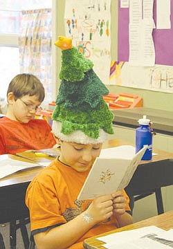 &lt;p&gt;Gerald Mereirs reads &quot;The Easter Story&quot; in class at K. William Harvey Elementary School in Ronan last Friday. Mereirs and other students wore hats to celebrate I Love to Read Month.&lt;/p&gt;