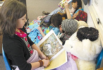 &lt;p&gt;Oryssa Hall reads to Rosie during individual reading time in Carey Swanberg's third grade class at K. William Harvey Elementary School in Ronan last Friday.&lt;/p&gt;