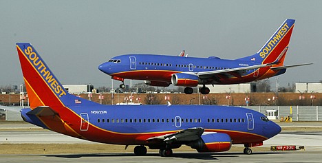 &lt;p&gt;FILE - In this Feb. 9, 2012 file photo, a Southwest Airlines Boeing 737 waits to take off at Chicago's Midway Airport as another lands. Airfares are up and headed higher in summer 2012. Airlines blame soaring fuel prices which could cost them billions more than last year. That means fares, which normally rise as the summer travel season nears, could increase faster than normal. The latest data on average fares show that Southwest charged $140 each way during the fourth quarter. JetBlue charged $156 and United Continental charged $270. The average fare rose 9 percent between January 2011 and January 2012, according to Airlines for America, a trade group of the biggest carriers. (AP Photo/Charles Rex Arbogast)&lt;/p&gt;