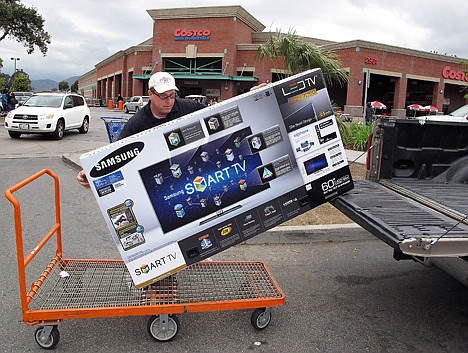 &lt;p&gt;In this Feb. 27, 2012 photo, a shopper from Los Angeles, loads a 60 inch Samsung LED TV into his truck at Costco Wholesale store in Glendale, Calif. A private research group says that consumer confidence in February rose to the highest level since a year ago when the U.S. economy?s outlook started to look brighter before souring again. (AP Photo/Damian Dovarganes)&lt;/p&gt;