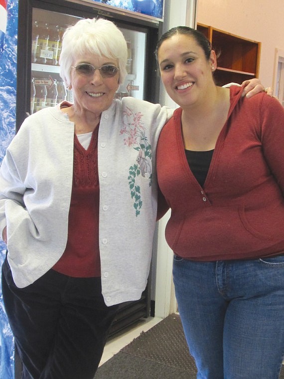 Area resident Chris Maniacki, left, stops by to find out "what's going on" from new Judy's manager Estela Cuevas. What's going on is a re-opening this Thursday.