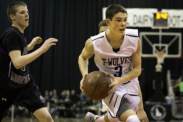 &lt;p&gt;SHAWN GUST/Press The Timberwolves' Chuckie Adams makes a move to the basket against Rocky Mountain High during the state 5A boys basketball tournament at the Idaho Center in Nampa.&lt;/p&gt;