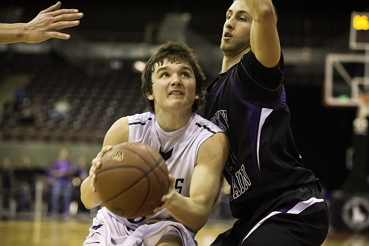 &lt;p&gt;SHAWN GUST/Press Lake City's Justin Pratt drives to the hoop against Rocky Mountain High School during the state 5A boys basketball tournament at the Idaho Center in Nampa.&lt;/p&gt;