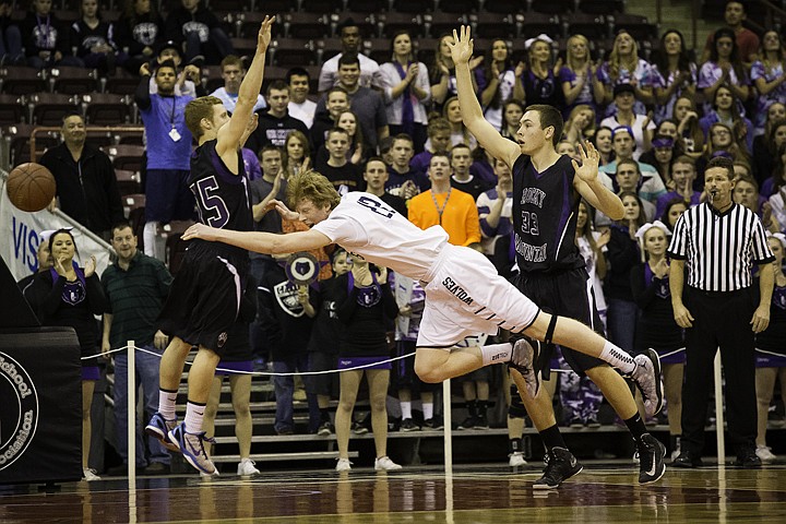 &lt;p&gt;SHAWN GUST/Press Kyle Guice, of Lake City High, comes off his feet between two Rocky Mountain defenders during the state 5A boys basketball tournament at the Idaho Center in Nampa.&lt;/p&gt;