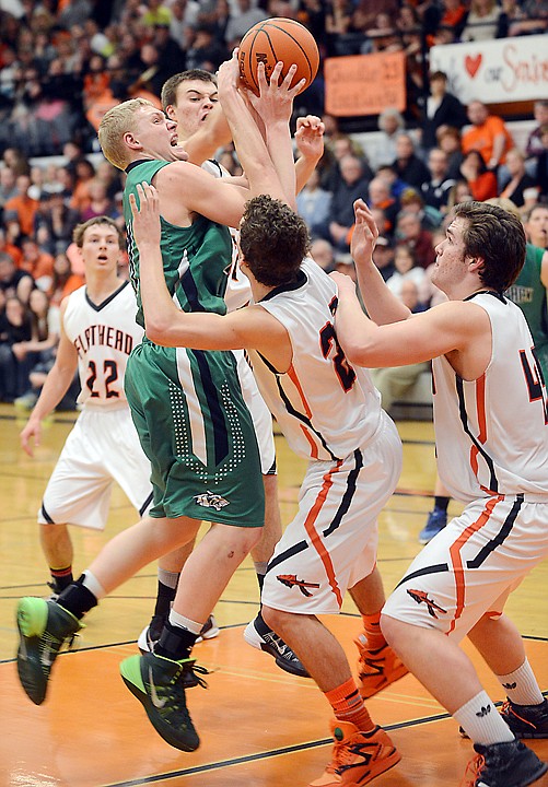 &lt;p&gt;Glacier senior Bryan Michaels shoots under pressure from Flathead senior Matt Quist during the crosstown game on Friday at Flathead. Glacier won the game 62-47. (Brenda Ahearn/Daily Inter Lake)&lt;/p&gt;