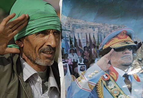 &lt;p&gt;A pro-Gadhafi supporter simulates the salute portrayed in a photograph of the Libyan Leader Moammar Gadhafi, as he and others stage a small rally at the Sabratha archaeological site in Libya on Monday.&lt;/p&gt;