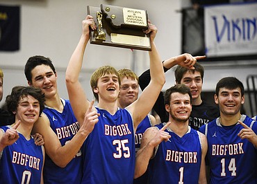 <p>Bigfork senior Garrett Beville (35) celebrates with his teammates after the Vikings' win over Florence on Feb. 27 at Flathead High School (Aaric Bryan/Daily Inter Lake)</p>