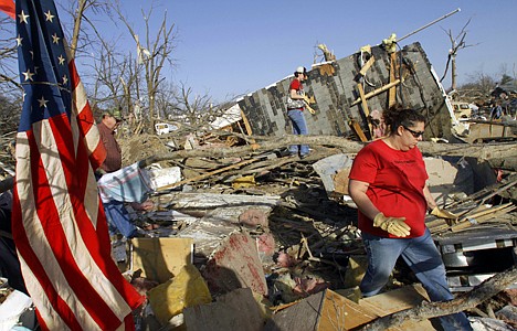 &lt;p&gt;Family members and friends try to salvage what they can after a tornado destroyed their neighborhood homes Wednesday, Feb. 29, 2012, in Harrisburg, Ill. The tornado that blasted Harrisburg, killing six, was an EF4, the second-highest rating given to twisters based on damage. Scientists said it was 200 yards wide with winds up to 170 mph. (AP Photo/Seth Perlman)&lt;/p&gt;