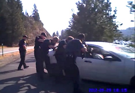 &lt;p&gt;In this still taken from a Coeur d'Alene Police officers body-mounted camera, law enforcement approaches after firing approximately 77 rounds at a 2004 Ford Focus driven by Christian Buquet during a pursuit in Sept. of 2012. Buquet was killed in the shooting and, in documents released Friday, Kootenai County Prosecutor Barry McHugh said the actions of the officers were justified.&lt;/p&gt;