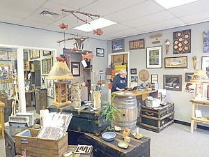 <p>Karen Anderson works at her computer at Real Art Works in Troy. The business, a high-end co-op, has flourished amid tough economic times in Lincoln County.</p>