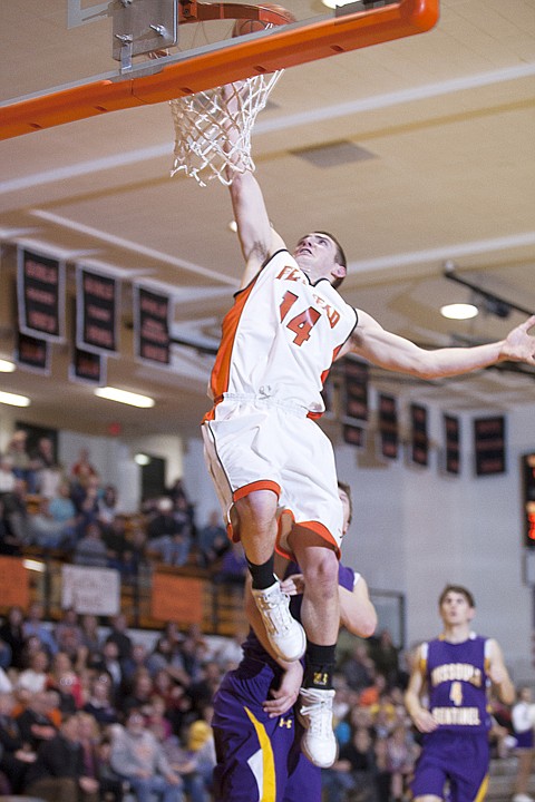 &lt;p&gt;Flathead junior Matt Tokarz (14) lays the ball in as a Missoula Sentinel player trails on the play Thursday night at Flathead High School.&lt;/p&gt;