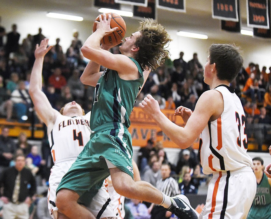 &lt;p&gt;Glacier's Noah Lindsay crashes into Flathead's Seth Adolph (4) as Sam Elliott (33) looks on during the Wolfpack's 52-37 win at Flathead on Tuesday. Lindsay was called for an offensive foul on the play. (Aaric Bryan/Daily Inter Lake)&lt;/p&gt;