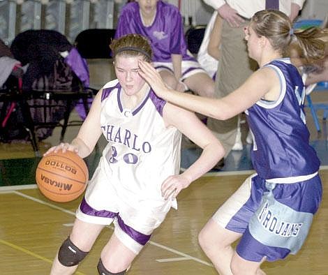 Zach Urness/Leader - Shianne Montgomery, the only starting underclassman, drives to the hole in Charlo’s challenge game win over Drummond Monday night.