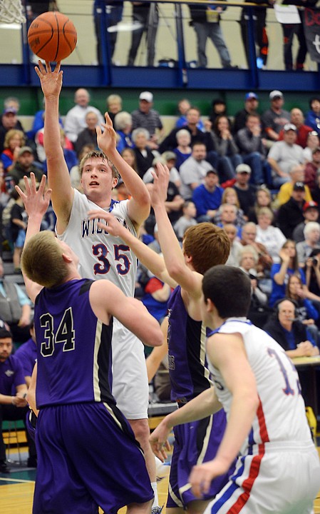 <p>Columbia Falls senior Jared Trinastich (35) shoots for two in the game against Polson on Saturday, March 1, at the Northwestern A Divisional Tournament in Kalispell. (Brenda Ahearn/Daily Inter Lake)</p>