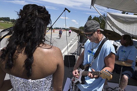 &lt;p&gt;Volunteer Chris Kidd entertains Ironman triathletes along highway 95 with his band &quot;Hell America&quot; Sunday, June 23, 2013.&lt;/p&gt;