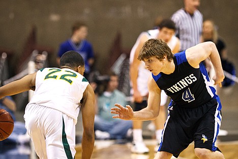 &lt;p&gt;Joe Roletto provides the Coeur d'Alene boys team with defense against a Borah guard.&lt;/p&gt;