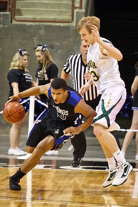 &lt;p&gt;Deon Watson dribbles past Cody Spjute of Borah High School after rebounding the ball in the first quarter.&lt;/p&gt;