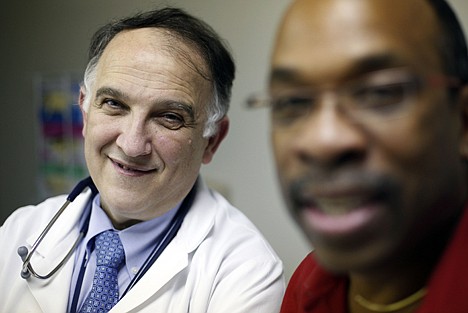 &lt;p&gt;In a Feb. 25 photo, Dr. Pablo Tebas, left, and Jay Johnson pose for a photograph at the University of Pennsylvania in Philadelphia. Tebas is leading a study testing gene therapy as a possible new way to treat and perhaps someday to cure infection with the AIDS virus. Johnson, who works for and AIDS advocacy and service organization in Philadelphia, took part in one of the studies.&lt;/p&gt;